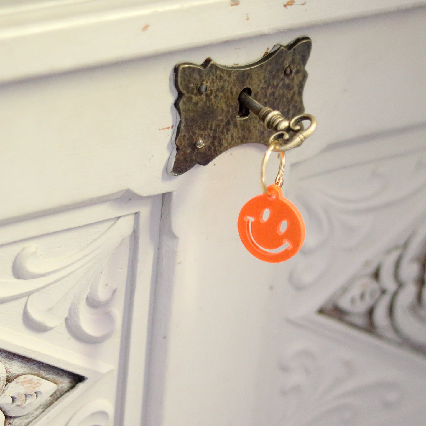 Troostsleutelhanger smiley FLUOR ORANJE